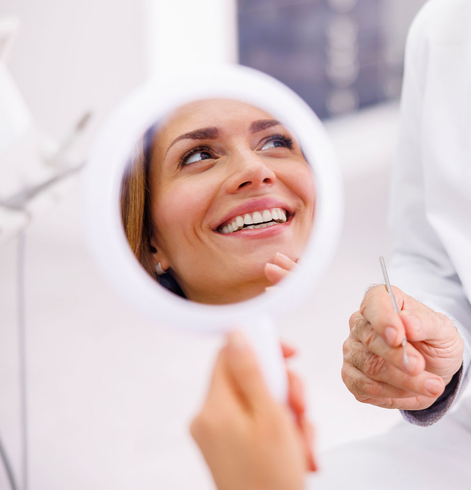 dental patient smiling brightly after their sinus lift procedure